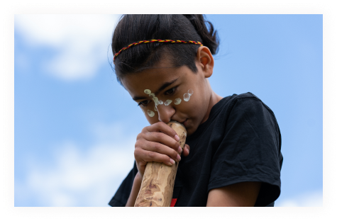 Girl Playing Didgeridoo
